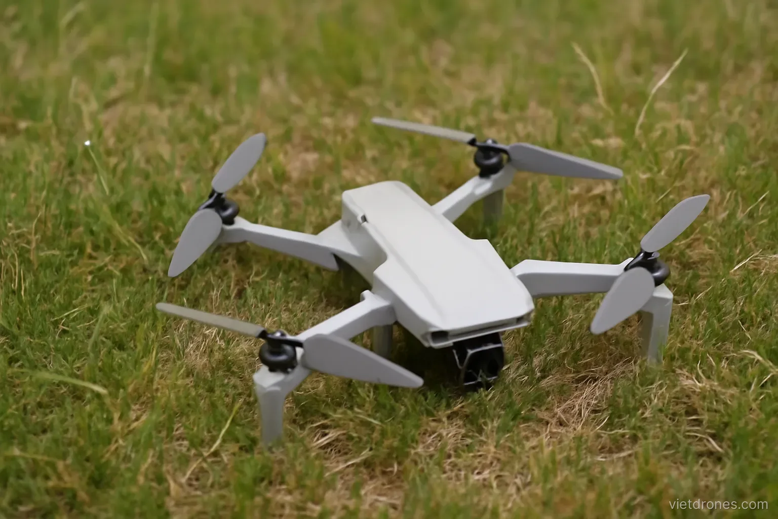 A drone lying on grass after landing awkwardly