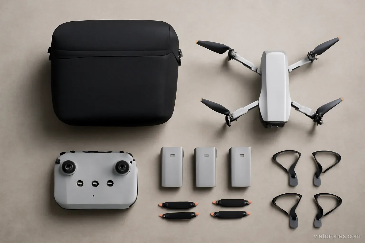 A complete drone kit laid out on a floor